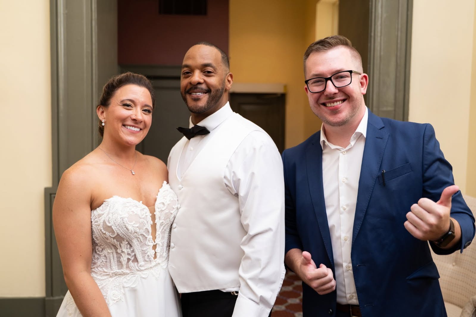 A bride and groom both react with amazement to Tyler's close-up magic at their reception